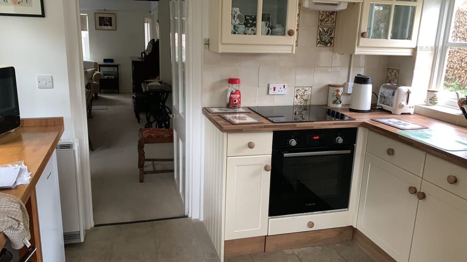 Cottage | Private kitchen | Fridge, microwave, stovetop, highchair