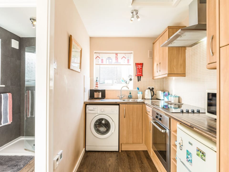 Cottage | Private kitchen | Fridge, microwave, stovetop, highchair