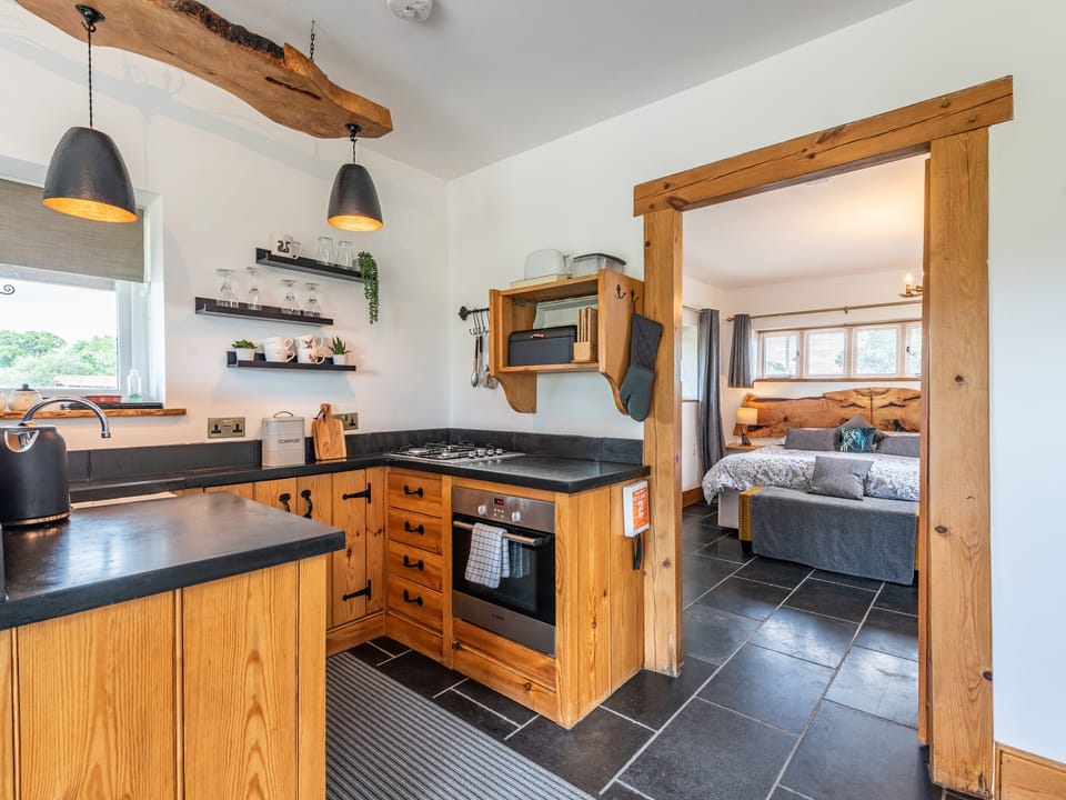 Cottage | Private kitchen | Fridge, microwave, stovetop, highchair