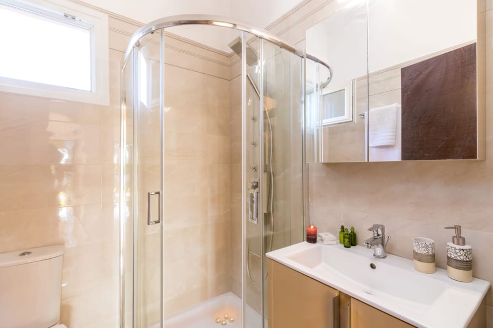 Shower, free toiletries, hair dryer, slippers