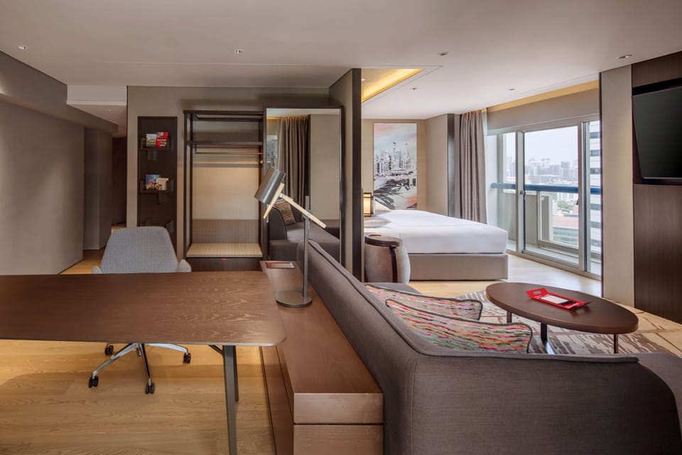 Signature Suite, 1 King, 2 Balconies, City View | In-room safe, desk, laptop workspace, blackout drapes