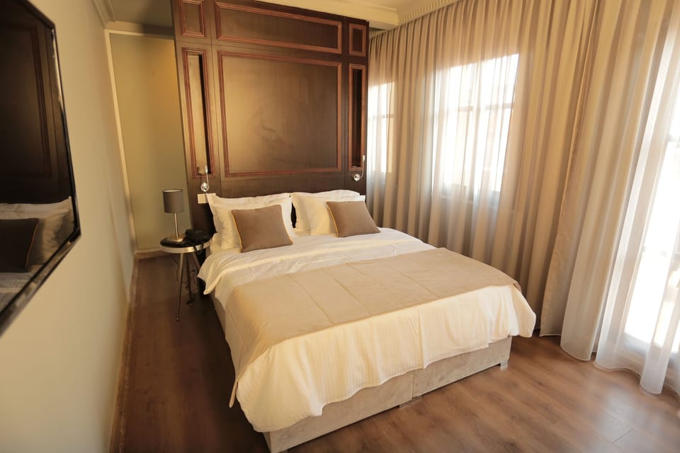 Junior Suite, Non Smoking, Balcony | In-room safe, desk, blackout drapes, iron/ironing board