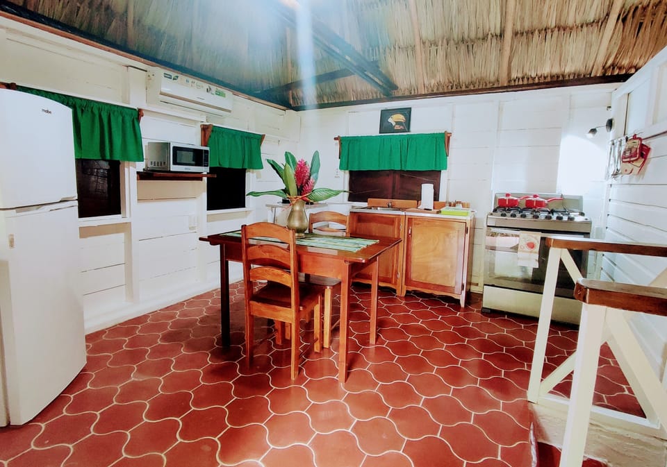 Standard Cabin, 1 Queen Bed, Pool Access, Garden View | Private kitchen | Coffee/tea maker, electric kettle, paper towels, dining tables