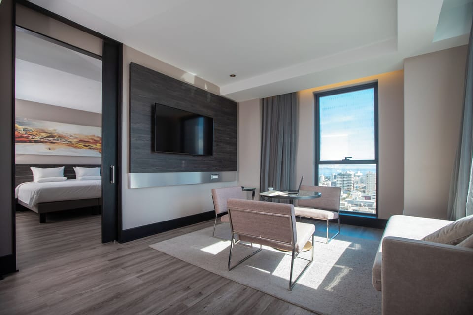 Superior King Suite | Minibar, in-room safe, desk, laptop workspace