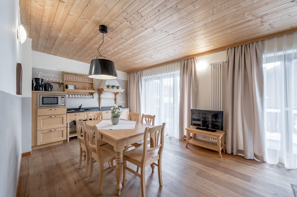 Deluxe Apartment, 2 Bedrooms, Balcony | Living area | Flat-screen TV
