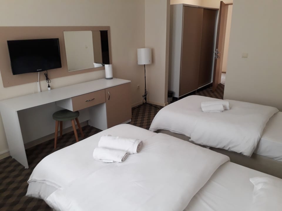 Classic Twin Room, 2 Twin Beds | Living area | LED TV