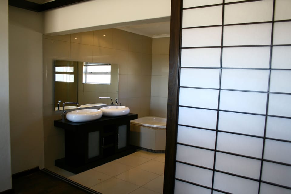 Deep soaking tub, rainfall showerhead, free toiletries, towels