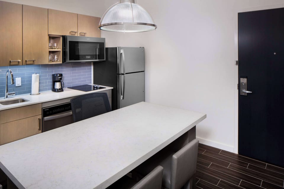 Suite, 1 Bedroom | Private kitchen | Fridge, microwave, coffee/tea maker