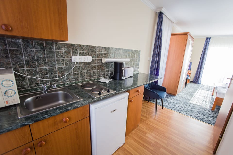 Superior Apartment, 1 Queen Bed | Minibar, in-room safe, desk, blackout drapes