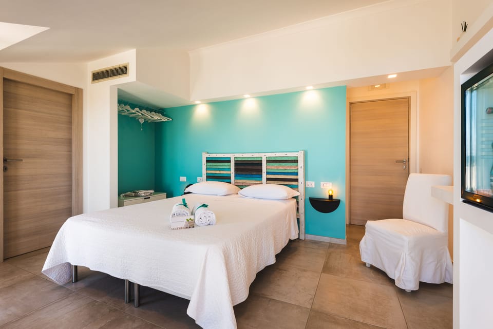Deluxe Double Room (Ischia) | Minibar, in-room safe, individually decorated, desk