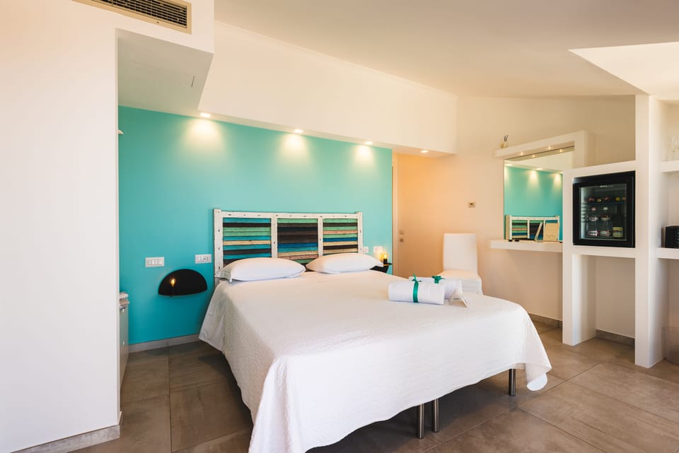 Deluxe Double Room (Ischia) | Minibar, in-room safe, desk, blackout drapes