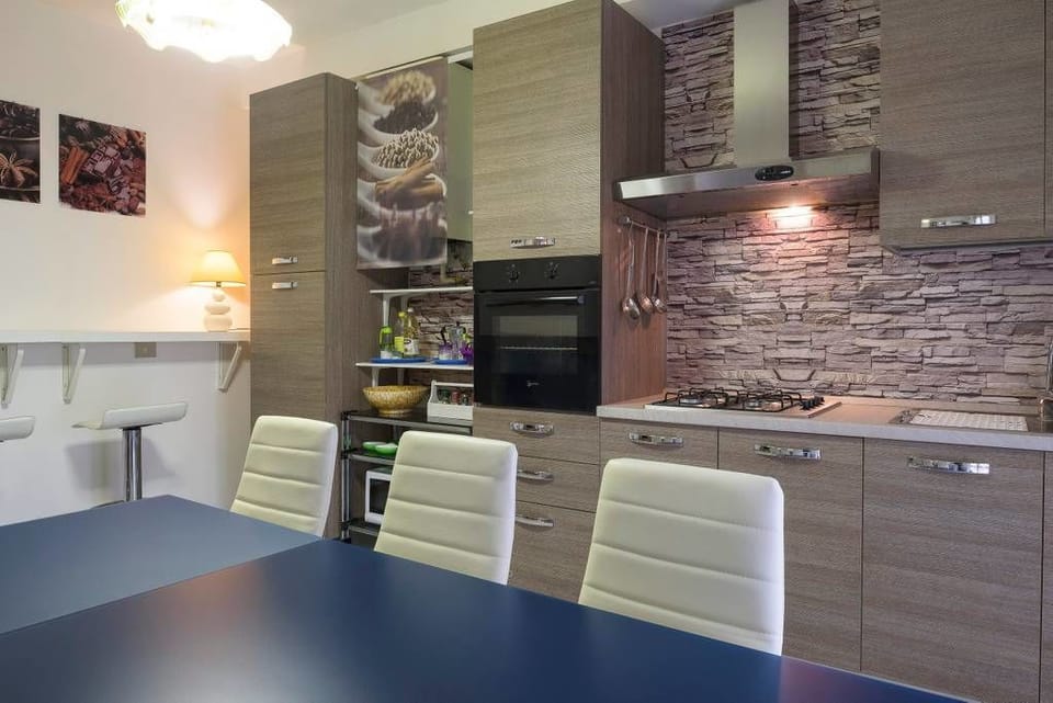 Apartment, 3 Bedrooms | Private kitchen | Full-size fridge, oven, stovetop, coffee/tea maker