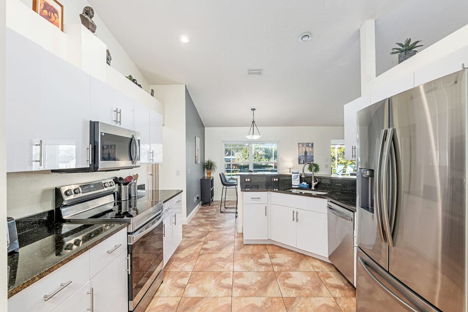 Villa | Private kitchen | Fridge, microwave, oven, stovetop