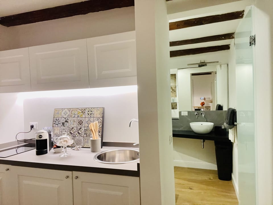 Exclusive Apartment, 1 Bedroom, Kitchen, Mezzanine | Bathroom | Deep soaking tub, free toiletries, hair dryer, bathrobes