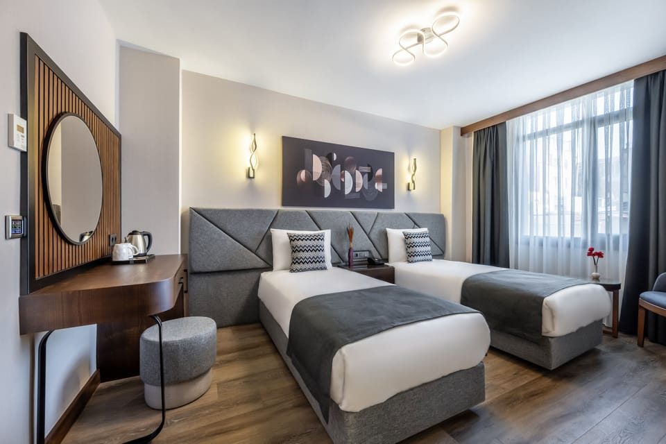 Deluxe Twin Room | 1 bedroom, minibar, in-room safe, desk