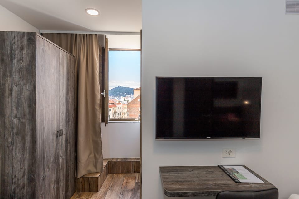 Standard Twin Room | Minibar, in-room safe, desk, iron/ironing board (on request)