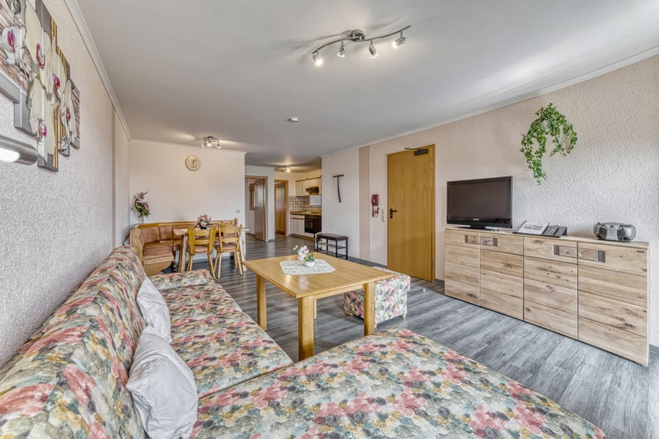 Apartment, 2 Bedrooms (Type C) | Living area | Flat-screen TV
