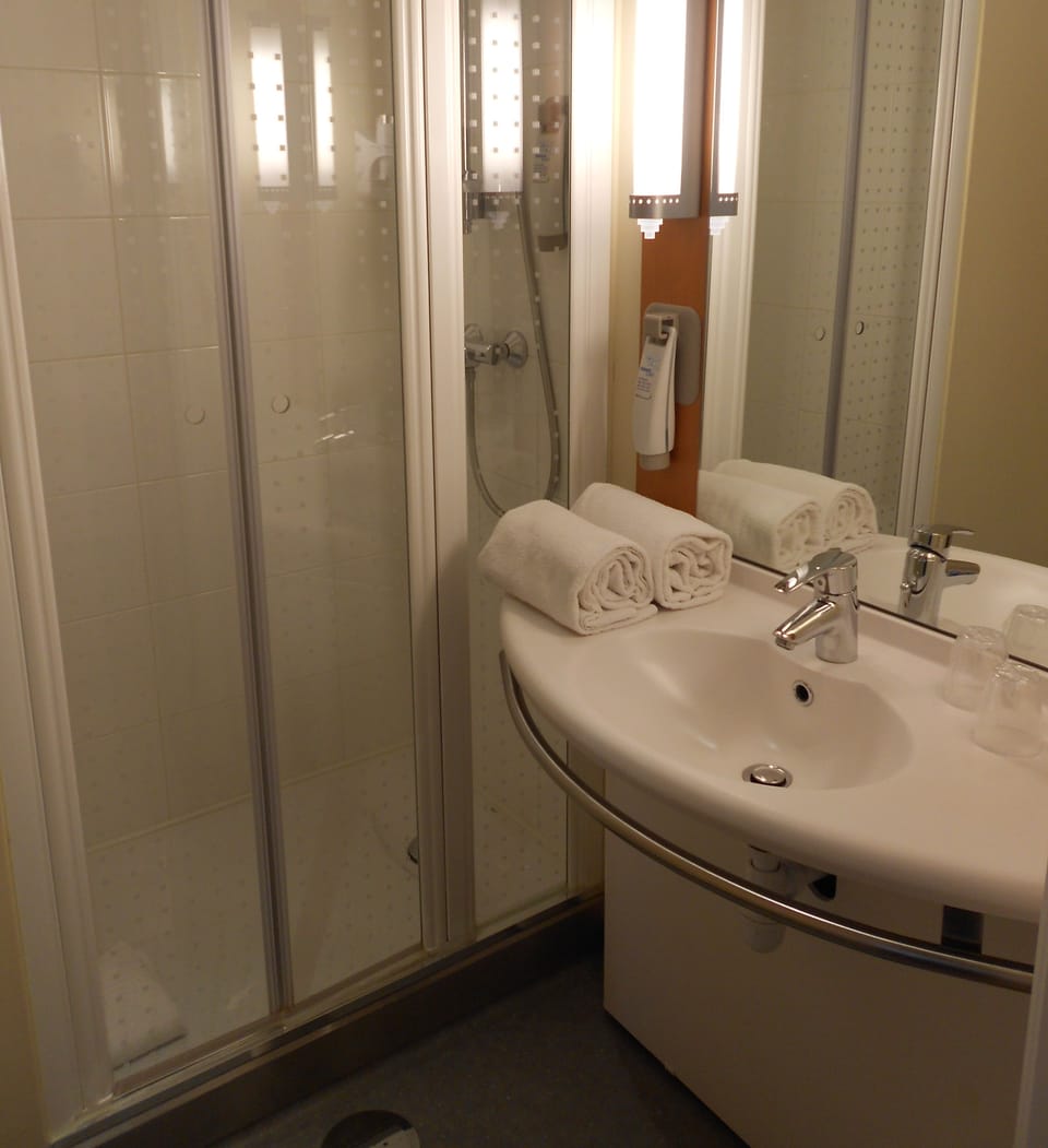 Shower, eco-friendly toiletries, hair dryer, towels