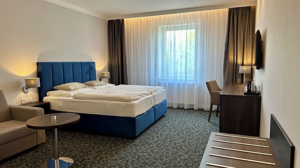Deluxe Triple Room | Desk, laptop workspace, blackout drapes, free WiFi