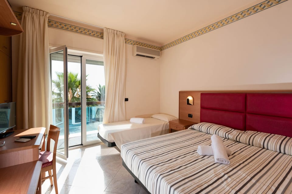 Classic Triple Room, Multiple Beds, Non Smoking | In-room safe, desk, blackout drapes, free WiFi