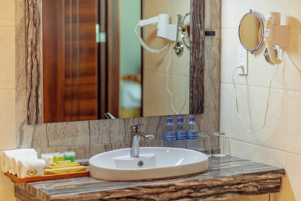 Superior Room, 1 King Bed | Bathroom | Shower, rainfall showerhead, designer toiletries, hair dryer