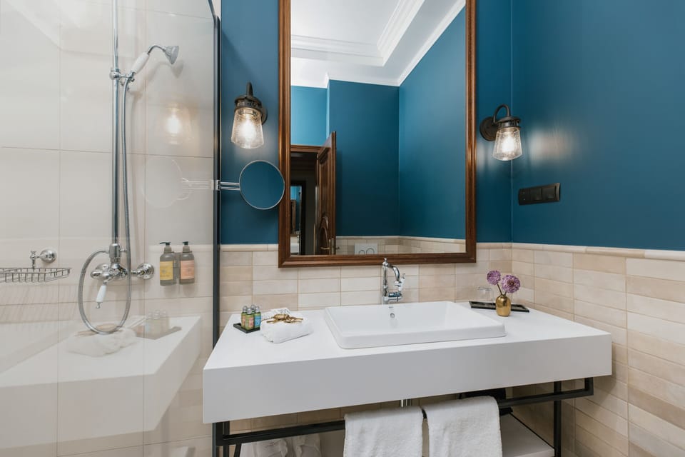 Combined shower/tub, designer toiletries, hair dryer, bathrobes