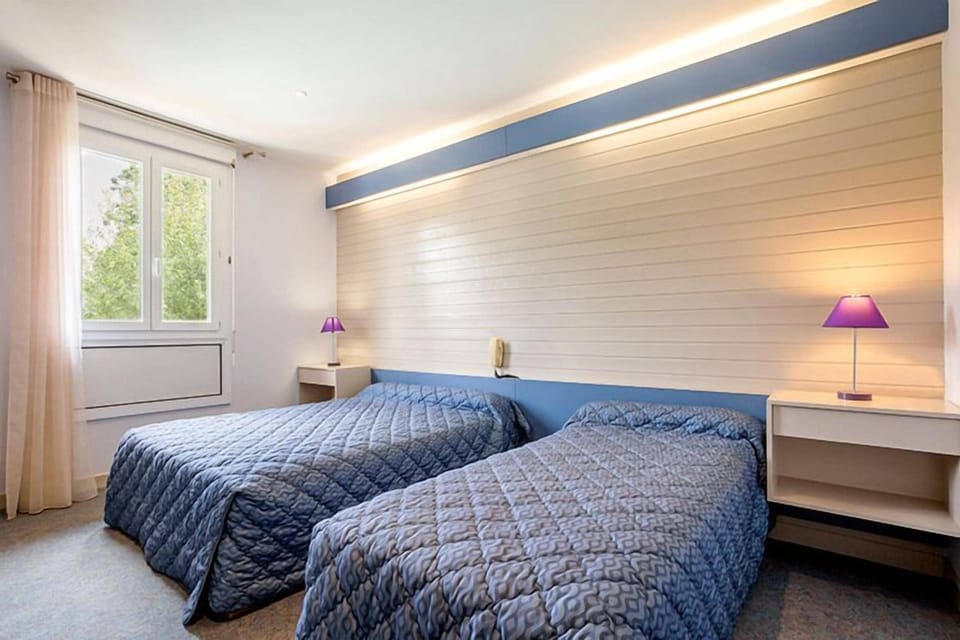 Twin Room | Premium bedding, desk, blackout drapes, soundproofing