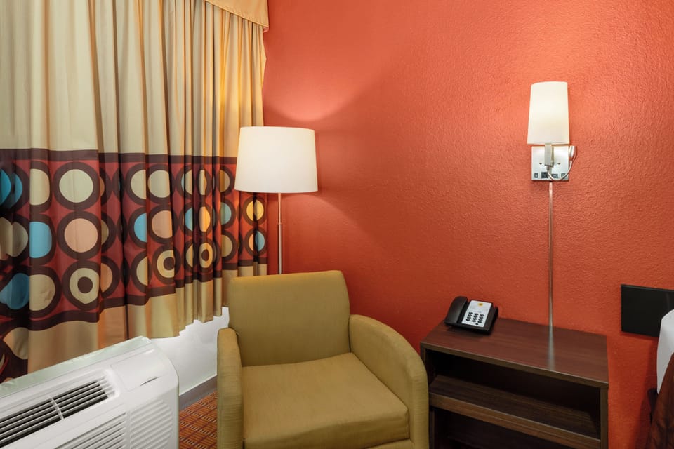 Desk, blackout drapes, iron/ironing board, free cribs/infant beds