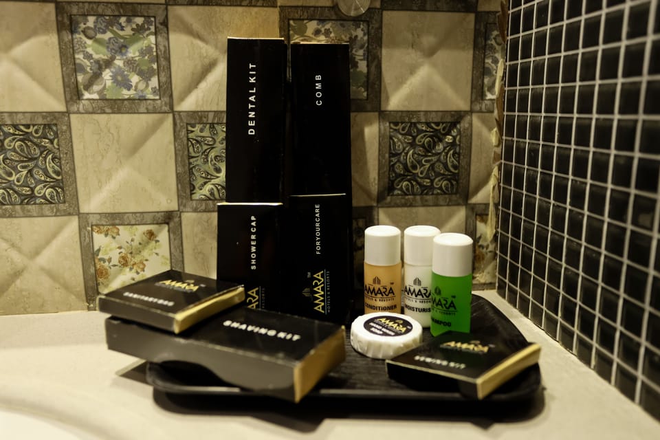 Amara Premium Room | Bathroom | Shower, rainfall showerhead, free toiletries, hair dryer