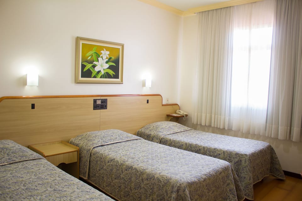 Standard Triple Room, 3 Twin Beds | Minibar, in-room safe, desk, blackout drapes