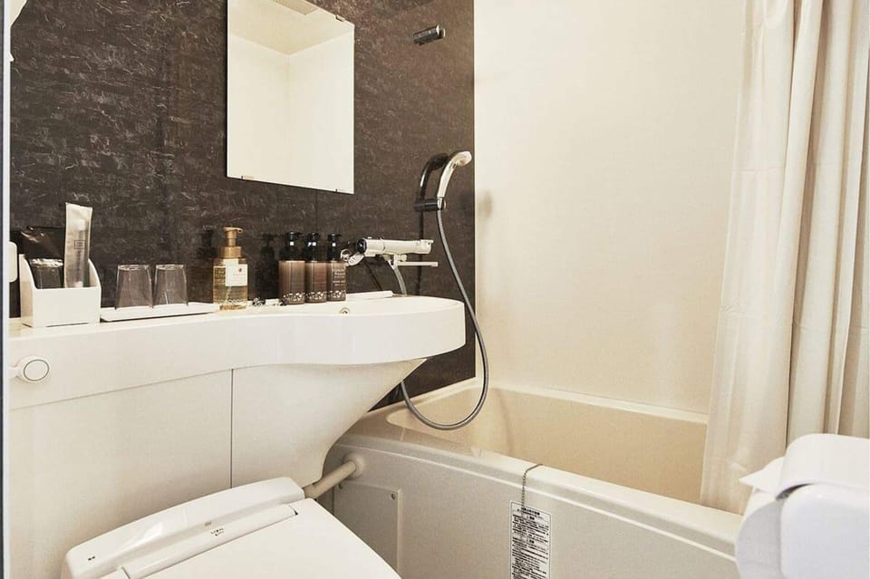 Shower, free toiletries, hair dryer, slippers