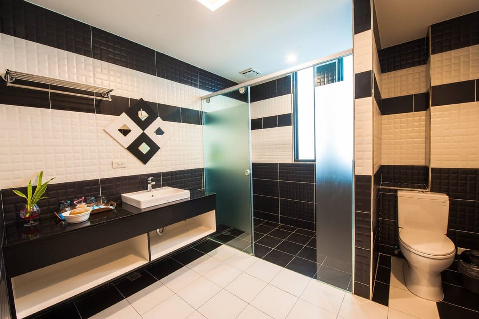 Classic Quadruple Room, 2 Queen Beds, Non Smoking | Bathroom | Shower, free toiletries, hair dryer, slippers