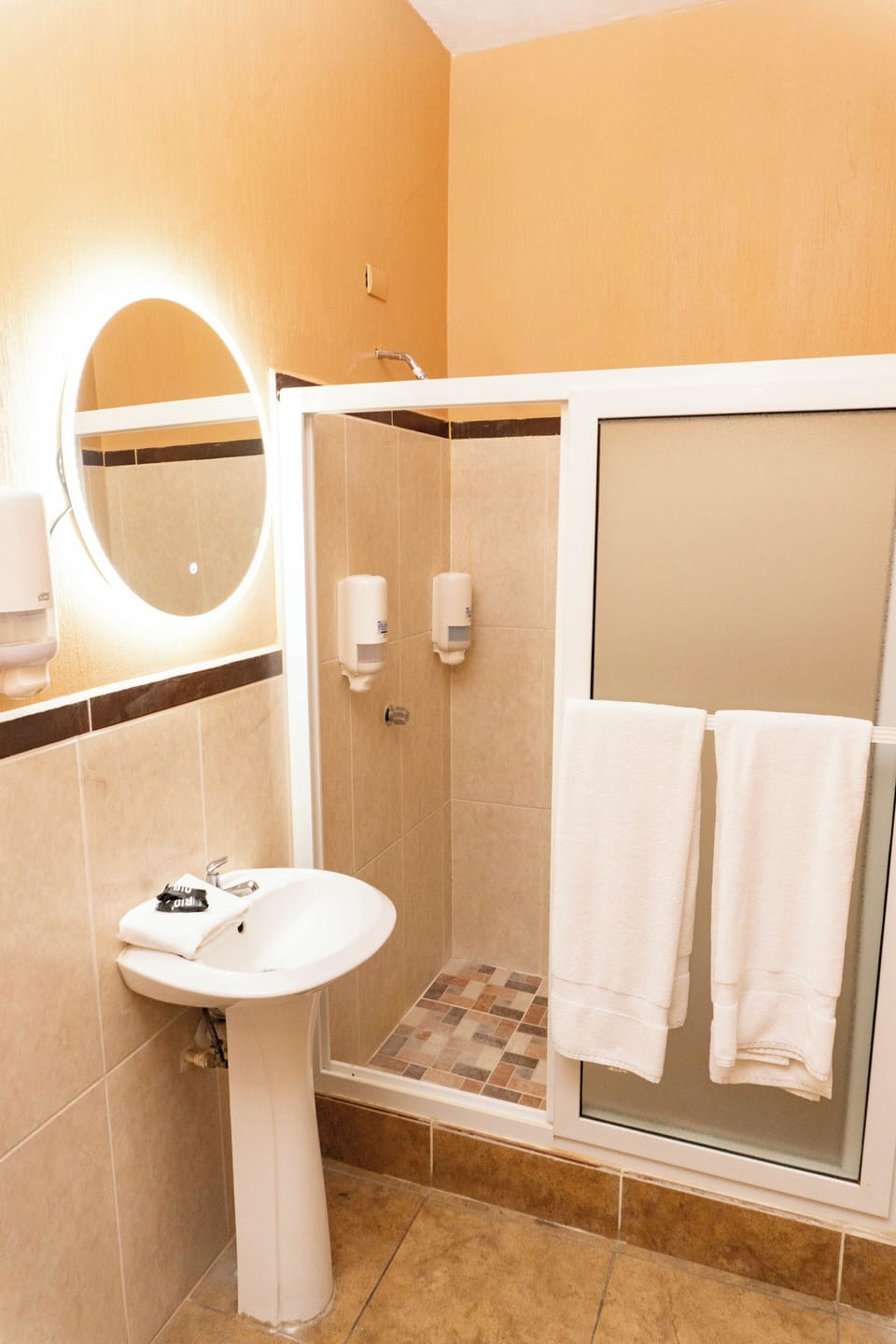 Shower, free toiletries, towels, soap