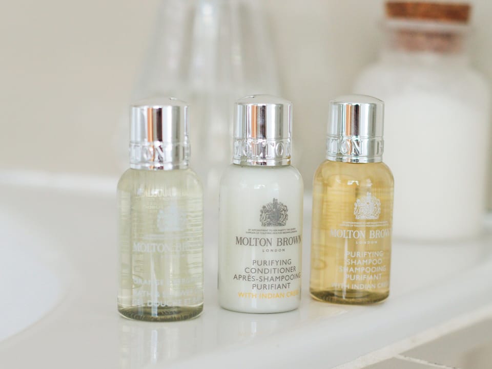 Designer toiletries, hair dryer, towels