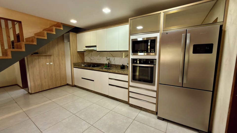 Oven, stovetop, electric kettle, cookware/dishes/utensils