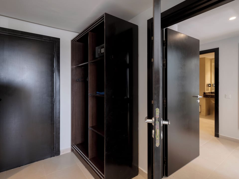 Standard Triple Room, Pool View | Minibar, in-room safe, blackout drapes, soundproofing