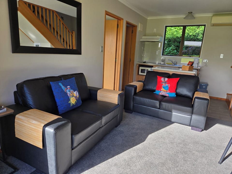 2 Bedroom Self-Contained Cottage | Living area | Flat-screen TV, toys