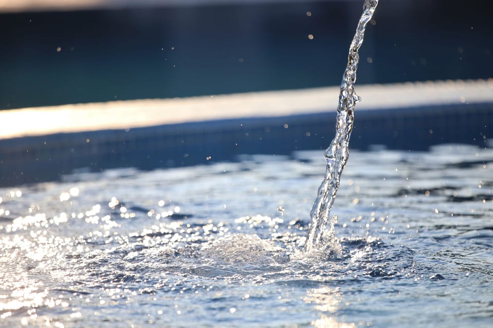 Seasonal outdoor pool, open 8:00 AM to 7:00 PM, pool umbrellas