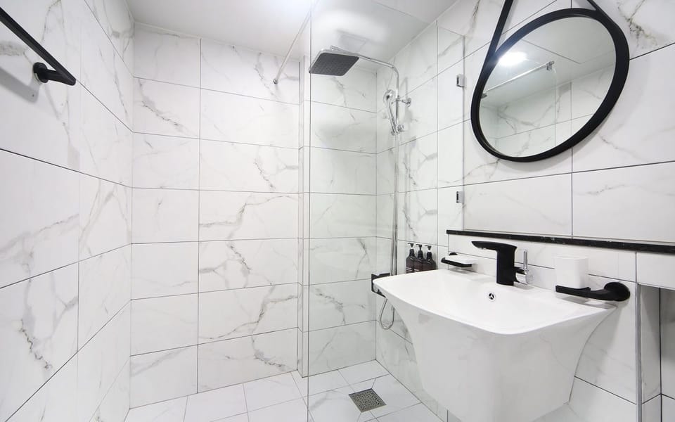 Deep soaking tub, designer toiletries, hair dryer, bathrobes