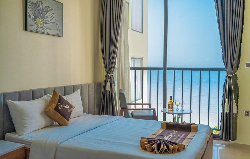 Premier Quadruple Room, Beach View | Minibar, in-room safe, desk, soundproofing