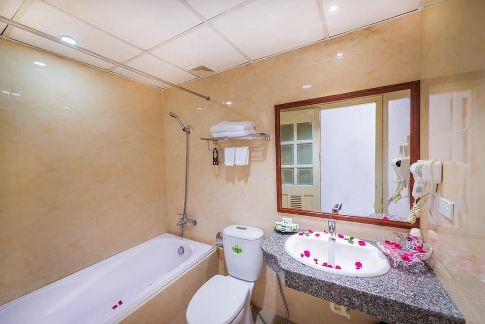 Shower, free toiletries, hair dryer, slippers
