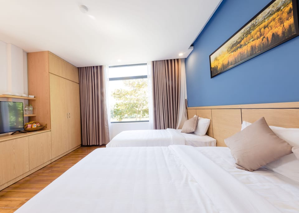 Deluxe Triple Room, River View | Minibar, desk, soundproofing, free WiFi
