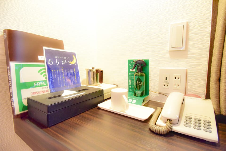 Desk, laptop workspace, blackout drapes, iron/ironing board