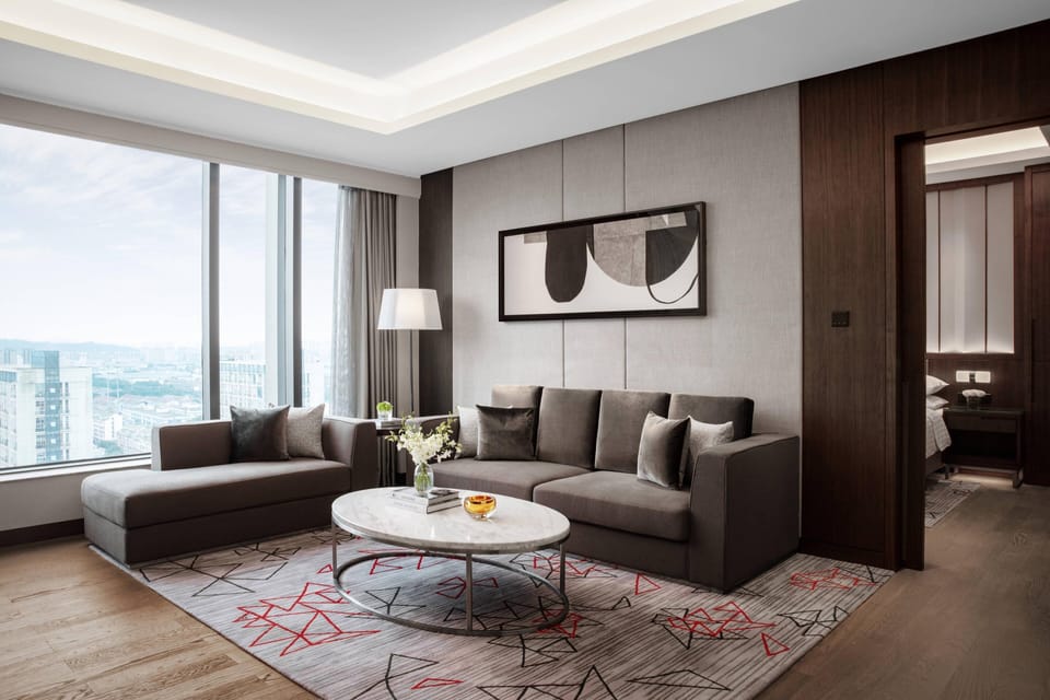 Executive Suite, 1 King Bed | Living area | 49-inch LCD TV with cable channels, TV