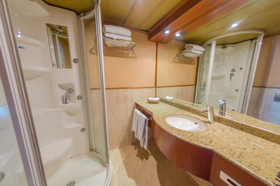 Shower, rainfall showerhead, designer toiletries, hair dryer