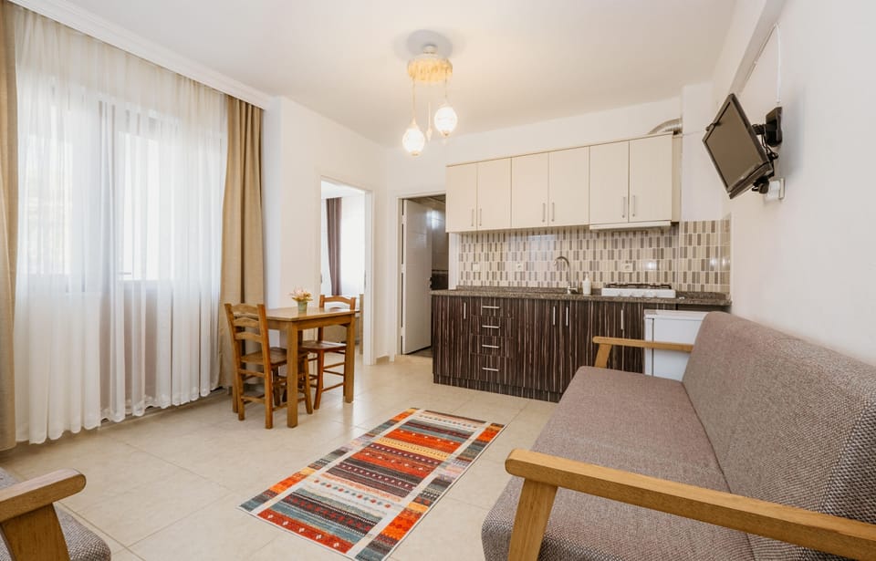 Family Suite, Garden View, Ground Floor | Private kitchenette | Full-size fridge, electric kettle