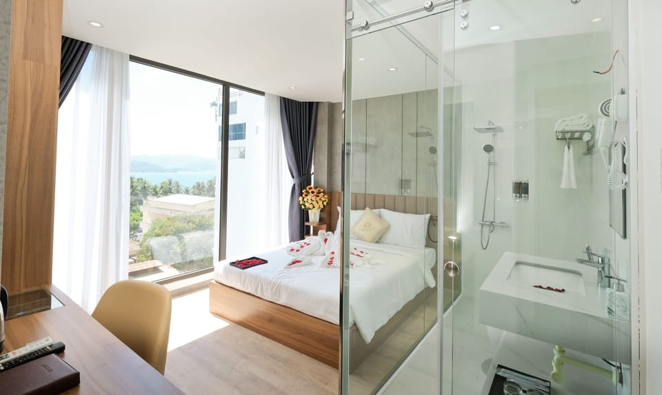 Deluxe Double Room, Partial Ocean View | Desk, free WiFi, bed sheets