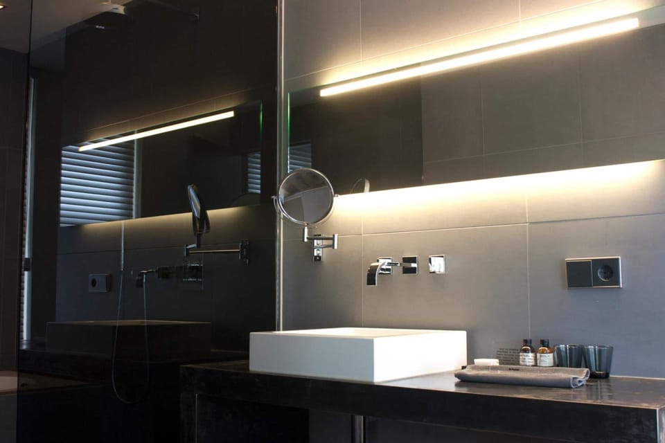 Designer toiletries, hair dryer, towels