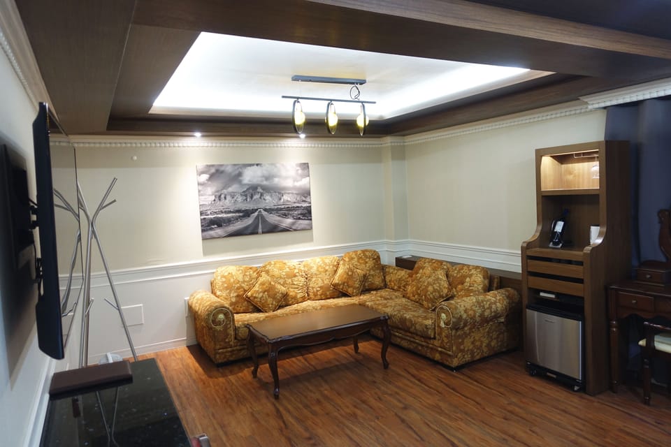 Premium Room | Living room | 50-inch flat-screen TV with cable channels, TV