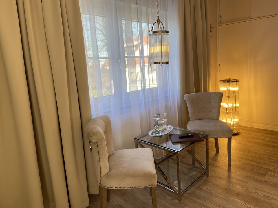 Deluxe Double Room | Living area | 49-inch Smart TV with satellite channels, TV